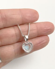 "Sterling Silver Pink Opal Heart Necklace Metal: All components are made from solid .925 Sterling Silver Stone: 8mm x 7mm Lab created Opal and Clear Cubic Zirconia Measurement: pendant height is 17mm (0.67\") including bail and 10mm (0.39\")wide Choose Chain Length At Checkout Please feel free to Convo me with any questions before purchasing. Please view policy before purchasing Other Opal Necklaces can be found here https://www.etsy.com/shop/LinksAndStones?ref=ss_profile&section_id=24284450 Silver Gemstone Heart Necklace For Valentine's Day, Silver Gemstone Heart Necklace For Anniversary, Silver Heart Necklace With Gemstone, Silver Gemstone Heart Pendant Necklace, Silver Double Heart Necklace With Birthstone, Sterling Silver Open Heart Birthstone Necklace, Silver Heart Cut Necklace Stamped 925, Sterling Silver Heart Necklace With Heart Beads, Opal Heart Necklace