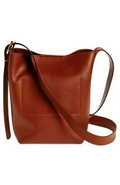 Madewell's newest leather bag collection is cool, modern and quietly luxe. With a magnetic closure and interior pocket, the mini bucket tote is perfectly sized to hold your phone, wallet, keys and more—plus, it has a shoulder strap and adjustable crossbody strap. It's so good, it's essential. Structured silhouette with flat base for stability Leather Imported Chic Square Bucket Bag For On-the-go, Modern Rectangular Bucket Bag For On-the-go, Cognac Bucket Bag For On-the-go, Chic Shoulder Bucket Bag With Cell Phone Pocket, Chic Bucket Shoulder Bag With Cell Phone Pocket, Chic Rectangular Bucket Bag With Cell Phone Pocket, Rectangular Workwear Bucket Bag With Removable Pouch, Rectangular Brown Bucket Bag For Work, Workwear Rectangular Bucket Bag With Removable Pouch