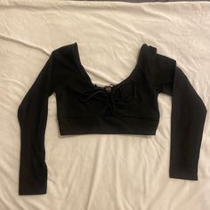 Sporty Victorias Secret Black Front Tie Long Sleeve Crop Top Brand New Without Tags - Has Never Been Worn. Size Medium. Black Long Sleeve Crop. Perfect For Yoga Or To Wear Out. Front Tie Adjusts The Top. Victoria's Secret V-neck Top For Party, Black V-neck Top By Victoria's Secret, Victoria's Secret V-neck Party Top, Victoria's Secret Stretch Tops For Night Out, Victoria's Secret Long Sleeve Tops For Summer, Victoria's Secret Fitted Top For Fall, Trendy Fitted Tops By Victoria's Secret, Victoria's Secret Long Sleeve Summer Tops, Victoria's Secret Long Sleeve Stretch Tops