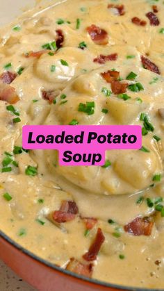 loaded potato soup with bacon and green onions in a red pot on the counter top