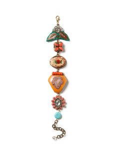 an assortment of jewelry hanging from a chain