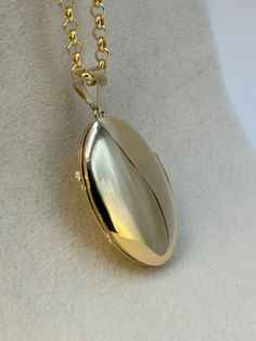 "14k Gold oval locket Necklace about 9.29 gr , 22 \", 3mm Priced to sell! Compare our prices to other similar sellers! Arrives in a GIFT BOX and includes FREE SHIPPING within the USA and Canada. International shipping is available at the most economical rates on ETSY. I HAVE BEEN IN THE JEWELRY BUSINESS ALL MY LIFE. I am a second -generation family member making gold and jewelry. Please feel free to ask me any questions - Always happy to help! Fast Replies to messages! Superior Quality and Best Prices!" Classic Locket Necklace With Charms For Gift, Personalized Oval Link Locket Necklace As Gift, Personalized Oval Link Locket Necklace For Gifts, Yellow Gold Locket Necklace With Charms For Gift, Classic Gold Locket Necklace With Polished Finish, Classic Gold Locket Necklace For Gift, Gold Round Locket Necklace With Charms, Classic 14k Stamped Medallion Locket Necklace, Classic Gold Locket Necklace For Keepsake