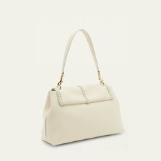 Chloe "Penelope" calf leather shoulder bag with whipstitch and tassel trim  Detachable flat top handle Detachable shoulder strap Flap top with flip-lock closure Interior, zip pocket Lining: linen Approx. 9.4"H x 13.8"W x 5.1"D Professional cleaning recommended Made in Italy Professional Cleaning, Flats Top, 4 H, Top Handle, Leather Shoulder Bag, Calf Leather, Calf Skin, Chloe, Zip Pockets