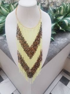 This thick necklace is made of fine multilayer beads wound together. It is very comfortable to wear and stays put around the neck. The beads are very bright and beautiful.  Contact owner for any personalization. Thanks for vising my shop and come again. Stay safe https://www.etsy.com/shop/naistumityujewelry Mixed Beads Necklace, December Birthstone Necklace, Thick Necklace, Turquoise Choker, Delicate Gold Necklace, Gemstone Choker, Gold Necklace Simple, Dainty Gold Necklace, Women Necklace