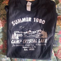 High Quality Tee And Perfect Condition!! Never Worn Or Washed. Size Xl In “Men’s” But Makes For A Cute Oversized Shirt For Anyone. I Personally Have Another & Made It A Crop Top! It’s My Favorite. Just Needs To Be Lint Rolled A Bit Before Sending Out!! Perfect For The Horror Movie Lover/Fans Of Friday The 13th #Campcrystallake #Jasonvoorhees #Summercamp #1980 #Vintagetshirts #Horrorlover #Hottopic #Killstar #Slasher Friday The 13th Shirt Ideas, Black Camp Shirt For Summer Outdoor Activities, Black Summer Camp Shirt For Outdoor, Casual Black Crew Neck Camp Shirt, Black Short Sleeve Camp Shirt For Outdoor, Black Tops With Text Print For Outdoor, Black Crew Neck Camp Shirt For Summer, Outdoor Black Shirt With Screen Print, Black Cotton Camp Shirt With Letter Print