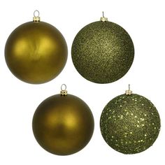 three green and gold christmas ornaments on a white background