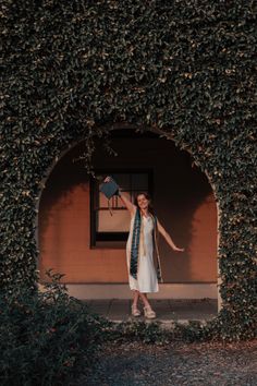 a woman standing in front of a building