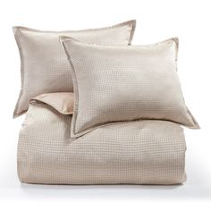 two pillows and one pillow on top of each other