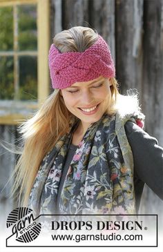 a woman wearing a pink headband and smiling at the camera with her hand on her hip