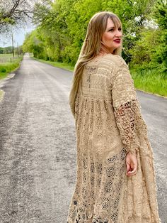 Embrace timeless fashion with The Dixieland Duster. This one-size crochet duster adds a statement piece to any outfit with its intricate details. Let your style shine with this must-have outerwear piece. model shown is a size 2/4, 5'6" tall and 34C bust fits sizes 2-18/20 very versatile in cut and fit 100% cotton Lace Crochet Dress For Fall, Oversized Open Knit Bohemian Outerwear, Long Bohemian Crochet Dress For Spring, Long Beige Crochet Dress For Spring, Bohemian Long Sleeve Crochet Dress For Fall, Long Lace Outerwear For Fall, Bohemian Crochet Lace Cardigan For Fall, Fall Crochet Lace Dress With Long Sleeves, Bohemian Open Knit Outerwear For Spring