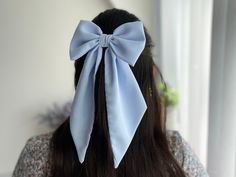 "Premium quality blue chiffon medium hair bow with pointed tail. Perfect accessory and gift for girls! This stylish hair bow is an ideal hair accessory for wearing to a special occasion or even everyday wear. 🎁It will also make a great \"gift for girl.\" They are handmade with love and care from  high quality fabric in our studio in England. 📍Attachment:  ✅Barrette  ✅Comb Slide ✅Alligator Clip 📏Bow measurement  15cm or 6\" in width appx  9 cm or 3 1/2\" in height  Tail is 21.50 cm or 8 1/2\" long (measured excluding the bow) *Please be noted that the color might appear a little differently on each phone, tablet, or computer screen." Diy Hair Accessories Ribbon, Hair Tie Accessories, Bow Hairstyle, Ribbon Hairstyle, Christmas Gifts For Girls, Diy Hair Bows, Diy Hair Accessories, Stylish Hair, Cute Bows