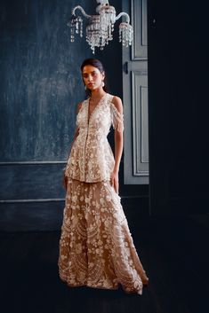 This three-piece outfit features platinum cut sequin and crystal embellishment in a leaf like pattern on a flowy open jacket and a cropped top. It is paired with a flared raw silk flared pants.From Seema Gujral’s Fiori collectionDELIVERY TIMEPlease allow 8-12 weeks for your outfit to arriveFABRIC DETAILSNetProfessional cleaning only Floral Sharara, Sharara Outfits, Wedding Sharara, Seema Gujral, Kurta Sharara Set, Kurta Sharara, Pearl Embroidery, Indian Couture, Sharara Set