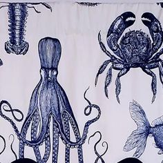 an octopus and other sea creatures are depicted on this blue and white wallpapered curtain