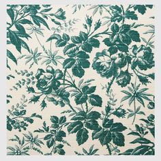 a green and white floral pattern on fabric