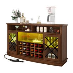 a wooden bar with bottles and glasses on the top shelf next to a blender