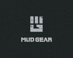 the logo for mud gear is shown in white and black colors on a dark background