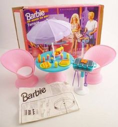 the barbie doll is set up to play with her friends and other toys, including an umbrella