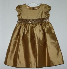 NWT Gymboree Prim and Proper gold silk dupioni dress.  Features a velvet sash that is hand-detailed with bugle beads and metallic stitching.  The dress is fully lined with a poly-satin lining.  Hidden back zipper.   A different size may be pictured to save some picture-taking time. Check out all my matching items in my listings and in my ebay store . I have a matching little sister dress listed in my ebay store.  All items come from a smoke free home. Payment is expected within 7 days. Serious b Elegant Short Sleeve Christmas Dresses, Elegant Holiday Dress-up Dresses, Elegant Gold Dress For Dress-up Occasions, Gold Dress With Fitted Bodice For Festive Occasions, Festive Short Sleeve Dress-up Dress, Festive Fitted Dress For Dress-up Occasions, Festive Fitted Dress For Dress-up Events, Elegant Dress For Festive Dress-up, Elegant Festive Dress For Dress-up Occasions