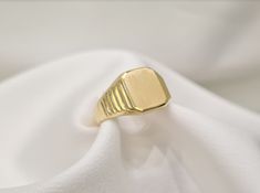 This ring is handmade of 14K yellow solid gold with mat octagon shaped top framed with eight shiny facets. The facets make the ring look like it has three levels. The ring is a perfect choice for everyday use. The ring can be resized for your finger size and be engraved on the top mat part with any symbols or letters of your preference. ❥ Free Express International Shipping ❥ Free Return within 5 days from the receiving day in case the jewel does not correspond to our site description. Features 14k Gold Octagon Signet Ring Gift, Octagon Yellow Gold Rings For Gift, Yellow Gold Octagon Rings For Gift, Octagon Signet Ring With Polished Finish As Gift, Yellow Gold Octagonal Rings For Gifts, Classic Gold Octagon Signet Ring, Elegant Octagon Signet Ring As Gift, Yellow Gold Octagon Signet Ring For Formal Occasions, Modern Octagon Signet Ring For Gift