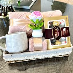 a table with a coffee cup, mug and other items sitting on top of it