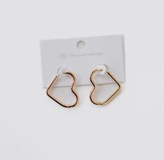 Add a touch of love to your ears with our Gold Open Heart Hoop Earrings! Waterproof and versatile, these earrings can be styled solo or stacked with other earrings for a playful look. Perfect for Mother's or Valentine's Day, these earrings make a great gift. Do good, be good. When you purchase this necklace, you are not only supporting a small business, but the type 1 diabetes community as well. A portion of all sales is donated back to non-profits like JDRF , T1 International, and American Diab Do Good Be Good, Heart Hoop Earrings, Open Heart, Type 1, Do Good, Gold Earrings, Of Love, Fun Things To Do, Valentine's Day