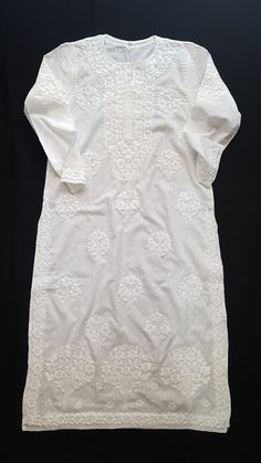 White Mulmul Kurta With Cutwork, White Cotton Traditional Wear With Chikankari Embroidery, White Cotton Kurta With Floral Embroidery, Traditional White Cotton Embroidered Fabric, White Cotton Embroidered Fabric With Motifs, White Embroidered Cotton Fabric With Motifs, White Mulmul Kurta With Motifs, Elegant White Traditional Wear With Cutwork, Cotton Cutwork Straight Kurta