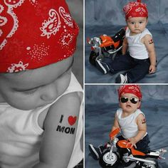 a baby wearing a red bandana on top of a motorbike with i love mom written on it