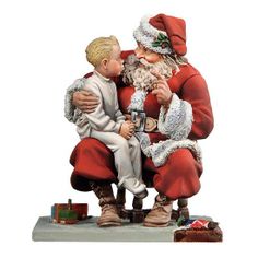 a figurine of santa claus holding a small boy in his lap and kissing him on the cheek