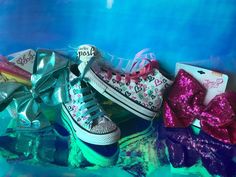 "Queen of Hearts* Fun, multicolored hearts Jojo Siwa's inspired custom bling high top Converse shoes This listing is for 1 authentic pair of customized Chuck's Converse high top shoes and 1 authentic Jojo Siwa's choose from: Ice Teal or Fuscia Sequin Bow Collection. Large bow measures W 7\" x 5\", A true fashionista! Your 'Queen of hearts' shoes are also customized with beautiful multicolored irridescent rhinestones on the toes and back. As well as, fun teal or fuscia ribbons as shoelaces to mat Rhinestone Converse, Custom Converse Shoes, Jojo Siwa Bows, Jojo Siwa Birthday, Converse High Top, Girls Shoes Sneakers, High Top Converse, Custom Bling, Hair Bow Sets