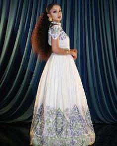 This gorgeous Habesha wedding dress is an exquisite piece that beautifully captures the essence of Ethiopian tradition. Crafted with intricate details, this Ethiopian traditional dress, also known as a Habesha Kemis, is perfect for your special day. Its elegant design and luxurious fabric make it a truly stunning choice for a traditional Ethiopian wedding. Material Cotton Menen Thread Estimated delivery : 1 week to 2 weeks Contact WhatsApp +1(304)-306-2784Email: contact@ethiopian.store Traditional Wedding Dress For Ceremonies, Traditional Fitted Wedding Dress With Drape, Semi-stitched Gown For Navratri And Traditional Ceremonies, Traditional Fitted Wedding Dress With Pallu, Traditional White Wedding Dress With Drape, Traditional White Wedding Dress For Festive Season, Traditional Floor-length Wedding Dress, Fitted Wedding Dress For Traditional Ceremonies, Fitted Wedding Dress For Traditional Ceremonies And Festive Season