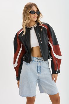 Level up your style game with the Dustin Leather Racer Jacket. This statement piece boasts a cropped length, contrasting colors, and a silhouette that's right on trend. Crafted from high-quality leather, it pairs perfectly with jeans or the matching micro mini. Cool and edgy, the Dustin is the ultimate addition to the model-off-duty wardrobe.