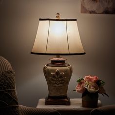 This ornate lamp showcases a highly embellished frame with a Cream, Off White and Antique Gold finish and a matching finial. An Off-White tapered oval softback shade with brown trimmed shade completes the gorgeous base. An elegant accent for a living room, office, or hallway, this lamp also works well on a dining room buffet or a bedroom nightstand. StyleCraft Home Collection Magonia 28.5-in Antique White with Gold Accents LED 3-way Table Lamp with Fabric Shade | L32331DS White Bird Of Paradise Plant, White Bird Of Paradise, Bird Of Paradise Plant, Paradise Plant, Bedroom Nightstand, Dining Room Buffet, White Bird, Bedroom Night Stands, Green Accents