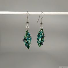 FREE SHIPPING

Unique elegant asymmetrical handmade earrings. Each pair is one-of-a-kind, making them the perfect gift for someone special. Green Intricate Design Dangle Earrings, Ornate Handmade Green Earrings, Green Artistic Dangle Earrings, Handmade Green Flower-shaped Earrings, Green Flower-shaped Nature-inspired Earrings, Leaves Earrings, Someone Special, Leaf Earrings, Handmade Earrings