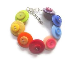 a multicolored bracelet with buttons attached to it