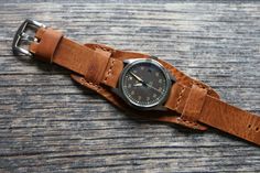 Horween leather watch band of High quality for men. Compatible with watch case 18mm, 20mm, 22mm, 24mm.
Brown leather cuff watch band handmade is unique. Due to the peculiarity of the leather from which the strap is made, there cannot be two such identical straps.
Bund strap is soft and elastic, pleasant to the touch and durable. Fits perfectly on your wrist and looks stylish, enhancing the beauty of your watch. Leather Crafting, Horween Leather, Leather Watch Band, Cuff Watch, Leather Watch Strap, Leather Watch Bands, Leather Cuffs, Watch Case, Watch Strap