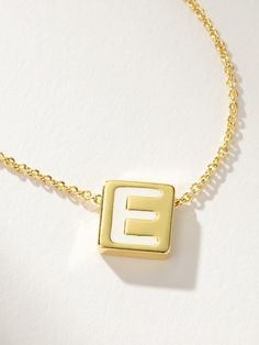 If there’s always an initial necklace in your stack, you need our Bold Letter Necklace. This block letter necklace brings a pop to your stack with its white lettering detail. Layer with our Textured Stud Necklace for a simple, everyday look. For a fully personalized look, shop our Initial Jewelry. | Gold Bold Letter Block Pendant Necklace with Initial A | Women's Jewelry by Uncommon James Everyday Charm Necklaces With Letter Beads, Trendy White Letter Jewelry, Trendy White Letter Shaped Jewelry, Trendy Everyday Initials Name Necklace, Everyday Trendy Initials Name Necklace, White Monogram Jewelry For Everyday, Minimalist White Name Necklace, Trendy Everyday Letter-shaped Jewelry, Everyday Minimalist White Name Necklace