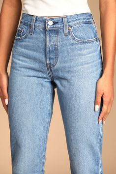 We just can't get enough of the Levi's Wedgie Straight Light Wash Distressed High-Rise Cropped Jeans! Sturdy denim (in Levi's Athens No Way wash) forms these incredibly cute and on-trend jeans with a five-pocket cut, belt loops, and high-waisted fit. Branded top button and hidden button fly top straight pant legs with frayed, cropped hems. Red logo tag and leather patch at back. Fit: This garment fits true to size. Length: Ankle length. Size 26 Waist: Fitted - very fitted at natural waist. Hip: Fitted Medium Wash Cargo Pants, Classic Medium Wash Fitted Pants, Fitted Classic Medium Wash Pants, Classic Fitted Medium Wash Pants, Levi's Classic Medium Wash Bottoms, Classic Levi's Medium Wash Bottoms, Fitted Cropped Bottoms With Pockets, Fitted High Rise Bottoms For Everyday, Classic High Waist Fitted Jeans