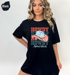 "Howdy American, Western Shirt, Cute Shirt, Western Graphic, for Women, Red White & Blue, 4th of July Shirt, Cowboy Tee, USA Tshirt  📣 Please check all photos for details. 📣 Use \"Add message to Seller\" link on the checkout page to send a message or important details for your order. 📣 We use Bella Canvas and Gildan when we have a shortage of stocks. 📣 Our printing method is DTF, Premium Vinyl and Heat Press. ♥ HOW TO ORDER ♥ 1- Please, Check and Review all Photos. 2- Select your shirt type, shirt size, shirt color from drop down menus and Choose your quantity. 3- Choose Your TEXT Color. Please add your text color on to the personalization box if applicable. 4- Click \"Add To Cart\". You can go back to add more product anytime you want, or you can complete the checkout process. 7- Fina Patriotic Black T-shirt With Letter Print, Americana Cotton T-shirt With Letter Print, Black Flag Print Top For Summer, American Style Pre-shrunk Short Sleeve Shirt, Black Tops With Flag Print For Summer, Patriotic Black Short Sleeve T-shirt, American Red T-shirt With Graphic Print, Black Patriotic Short Sleeve T-shirt, Casual Red T-shirt With American Flag Print