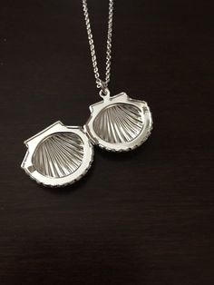 seashell locket, shell locket, shell necklace, seashell necklace, shell jewelry, seashell jewelry, silver shell necklace, shell, seashell, silver shell, necklace ★ Total Chain Length: 18 inches ★ Pendant Size: 2 cm This necklace is also available in gold: https://www.etsy.com/listing/679948995/seashell-seashell-necklace-seashell?ref=shop_home_active_1&frs=1 ★ Want to see more? Please click on: kmsupplies.etsy.com 11 Luxury Silver Shell Necklace, Human Heart Necklace, Seashell Locket, Silver Seashell Necklace, Shell Locket, Necklace Seashell, Necklace Shell, Seashell Jewelry, Seashell Necklace