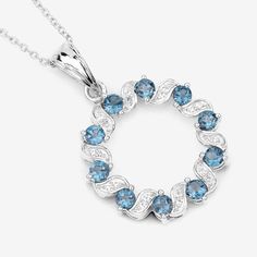 "London Blue Topaz Pendant, Wreath Design Natural London Blue Topaz Silver Pendant Necklace for Women, December Birthstone Pendant Necklace Product Details:  .925 Sterling Silver Stone Details: London Blue Topaz Item Type: Pendant Subcategory: Blue Topaz Gross Wt: 5.39 Gemstone Wt: 1.50 ctw Total Stone Wt: 1.50 ctw Finish: Rhodium Plated Product Style: Circle Pendant Chain Type: Cable Chain Clasp: Spring Ring Clasps Total Qty Of Stones: 30 Height: 4.57 MM Width: 22.35 MM Length: 33.53 MM Primary Blue Topaz Pendant Necklace, Blue Topaz Pendant, Topaz Pendant, Aquamarine Jewelry, Silver Gemstone Jewelry, Birthstone Pendant, Wreath Designs, December Birthstone, London Blue Topaz