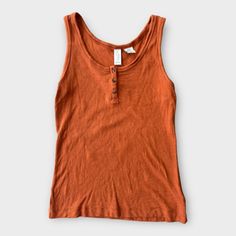 Elevate Your Casual Wardrobe With This Vibrant Women’s Joie Orange Ribbed Henley Button Tank Top In Size Medium. New Without Tags (Nwot), This Tank Top Is Perfect For Adding A Pop Of Color And Style To Your Everyday Outfits While Ensuring All-Day Comfort. Key Features: Brand: Joie Style: Ribbed Henley Button Tank Top Size: Medium Color: Orange Material: Soft And Stretchy Ribbed Fabric (Blend Of Cotton And Spandex) Design: Henley Button Front With Ribbed Texture And A Flattering Fit Condition: Ne Casual Tank Top With Buttons, Brown Buttoned Tops For Summer, Brown Summer Tops With Buttons, Casual Cotton Tank Top With Button Closure, Everyday Sleeveless Tops With Buttons, Sleeveless Tops With Buttons For Everyday, Everyday Tops With Buttons, Everyday Brown Buttoned Tops, Button Tank Top