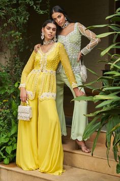 Yellow long sleeves short peplum jacket with floret embroidery using pearl, sequin and cutdana highlights. Paired with a flared plain sharara. - Aza Fashions Elegant Pant Set For Reception With Long Sleeves, Elegant Long Sleeve Pant Set For Reception, Georgette Long Sleeve Pant Set With Dupatta, Long Sleeve Georgette Pant Set With Dupatta, Elegant Pant Set With Zari Work And Long Sleeves, Georgette Long Sleeve Pant Set For Wedding, Long Sleeve Georgette Pant Set For Wedding, Elegant Long Sleeve Pant Set With Zari Work, Festive Long Sleeve Palazzo Set For Reception