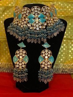 Product code- 98 Beautiful choker work Firozi meenakari and kachidakari work. watercolor blue and dark blue pearl beads Long earrings work push lock Blue Meenakari Chandbali Necklace, Blue Temple Jewelry Bridal Necklace With Meenakari, Blue Meenakari Bridal Necklace In Temple Jewelry Style, Blue Bridal Necklace In Temple Jewelry Style With Meenakari, Blue Chandbali Jewelry With Cutdana, Blue Chandbali Jewelry With Cutdana Detail, Blue Kundan Jewelry With Meenakari, Blue Chandbali Jewelry With Meenakari, Blue Cutdana Chandbali Jewelry