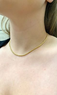 14k Diamond Cut beaded layering chain. Perfectly worn Alone or with a pendant. Also gorgeous as a choker/ stackable necklace. Material: Genuine 14k solid gold. Length: 16 inch. (Available in other lengths, weight will vary slightly on length chosen.) Width: Approximately 2.5mm wide. Weight: Approximately 8.6 grams. Comes in a nice box. Yellow Gold Beaded Chain Necklace, Gold Plated Chain Necklaces With Round Beads, Gold Choker With Round Beaded Chain, Gold Plated Necklace With Round Beads Chain, Gift Single Strand Choker Necklace, Yellow Gold Choker Necklace With Satellite Chain, Yellow Gold Double Strand Beaded Necklace, Dainty Yellow Gold Single Strand Beaded Necklace, Gold Beaded Choker With Satellite Chain