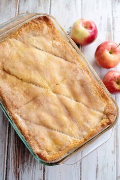 an apple pie sitting on top of a wooden table