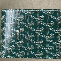 Brand New W/Tags - Bfold Men's/Unisex Wallet - In Beautiful And Most Coveted Green. Harder And Harder To Get These Days. Goyard Is Limiting Their Colors And Sales Of Items. Goyard Just Did Their Price Increase For 2024 So Prices Have Gone Up Again! Beautiful Goyard Card Holder In Brilliant House Color Green. A Traditional Color And A Timeless Classic Piece. Goyardine Canvas And Calfskin Leather. This Is A Rare Beautiful Color! In Perfect/Mint Condition. Unworn, Unused. Negotiable. Offers Accepte Designer Green Wallets With Interior Card Slots, Designer Green Wallet With Interior Card Slots, Green Designer Wallets With Interior Card Slots, Luxury Green Wallets With Card Slots, Luxury Green Wallets With Interior Card Slots, Green Luxury Wallets With Interior Card Slots, Luxury Green Wallet With Interior Card Slots, Luxury Green Wallet For Everyday Use, Green Luxury Wallet With Interior Card Slots