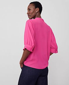 Elevate your wardrobe with the Ann Taylor Pleat Neck Popover Top, a stunning blend of style and comfort. This top features delicate pleats and charming ruffle cuffs that add a touch of sophistication to any outfit. 

- Size: XS
- Color: Hot Pink Poppy
- Material: 100% Polyester
- Gender: Female
- Fit: Blousy - our most relaxed fit
- Length: 25" long
- Care Instructions: Machine Washable

Designed for the modern woman, this top is perfect for both office wear and casual outings. The split neck an Spring Collared Top With Pleated Sleeves, Spring Collared Tops With Pleated Sleeves, Spring Pleated Workwear Top, Pleated Top For Spring Workwear, Chic Tops With Smocked Cuffs For Work, Relaxed Fit Work Tops With Smocked Cuffs, Feminine Spring Top With Cuffed Sleeves, Feminine Spring Tops With Cuffed Sleeves, Feminine Tops With Cuffed Sleeves For Spring