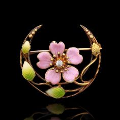 A Victorian 18k yellow gold crescent brooch with enameled flower and foliate designs featuring a single diamond in the center. SP274 Weight: 3.00 grams (Inclusive of all materials) Diamond (1) Old Mine Cut Color: H Clarity: SI1 Carat Weight: 0.20 ctw Yellow Gold Enamel Brooches Hallmarked, Yellow Gold Enamel Brooches, Art Nouveau Enamel Brooch Jewelry, Yellow Gold Enamel Flower Jewelry, Yellow Gold Flower Brooch, Yellow Gold Flower Brooch Jewelry, Yellow Gold Enamel Brooches For Gifts, Elegant Yellow Gold Enamel Brooches, Gold Enamel Art Nouveau Brooches