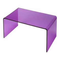 a purple coffee table sitting on top of a white floor next to a black frame