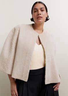 ME+EM's Cream Luxe Shearling Cape instantly adds a covetable edge to your edit of event and evening outfits. Shop now. Ladies Coat Design, Designer Coats, Contemporary Dresses, Women's Coats And Jackets, Evening Outfits, Coat Design, Coats And Jackets, Shearling Jacket, Fashion Story